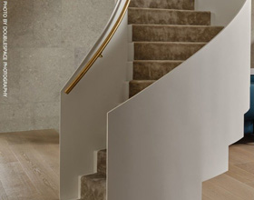 Sculptural steel stair reframes private residence