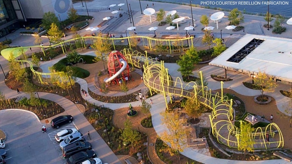 A steel “slinky” landmark illuminates Omaha’s riverfront