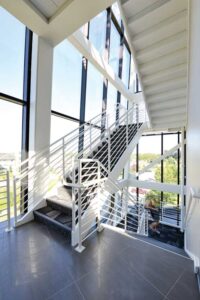 Curtainwall spans multiple floors, often starting at the first floor, and may extend up several floors.