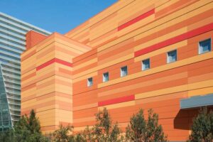 This vibrant color wall serves as not only as public wayfinding and a visual landmark, but also as an architectural signature along the expressway.