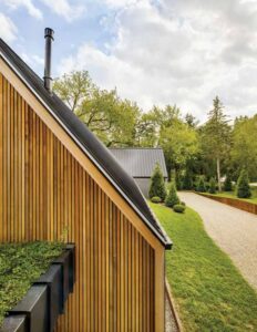 An up-close look at the metal roof and wood panelling on the exterior. 