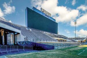 The left side of the stadium showing the bleachers, and Perdue scoreboard above. 