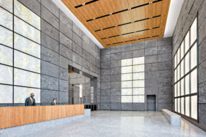 A reception area features grey marble panels and a light brown ceiling. 