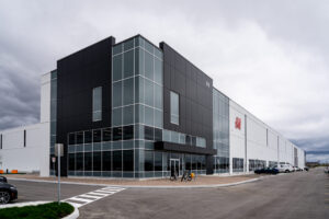To break up expansive elevations on H&M Hennes & Mauritz AB’s distribution center, Baldassarra Architects Inc. designed walls with materials including insulated metal panels (IMPs).