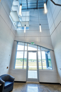 An interior, vertical view of the smooth, flat panels and tall ceilings.