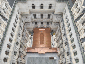 An aerial look at the stone courtyard shows a new copper roof which covers the restaurant below.