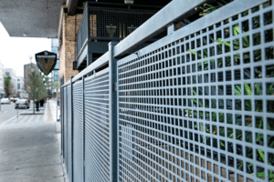 A close-up look at metal mesh in front of a restaurant's patio.