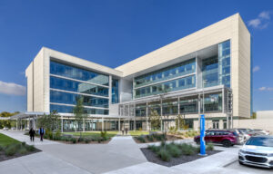 a building with windows massed with two perpendicular forms
