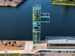 An aerial view of the tower located in the port. 