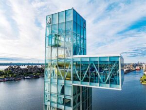 Overlooking the water, the glass observation deck juts out from the side of the tower. 