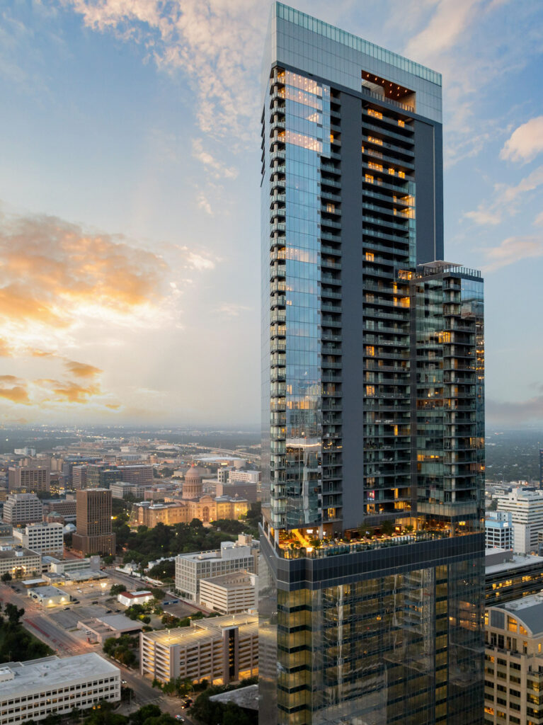 A tower of aluminum and glass stands over the Austin skyline.