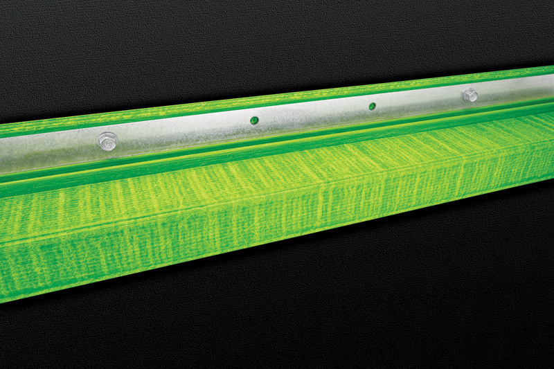 Steel flanges fastened to a section of insulation with bolts.