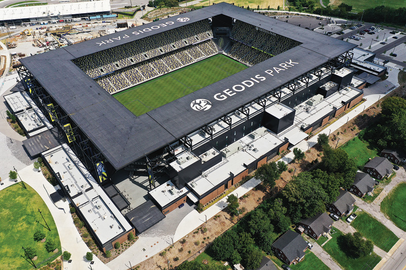 An overhead shot of a rectangular sports arena surrounded by a suburban area.