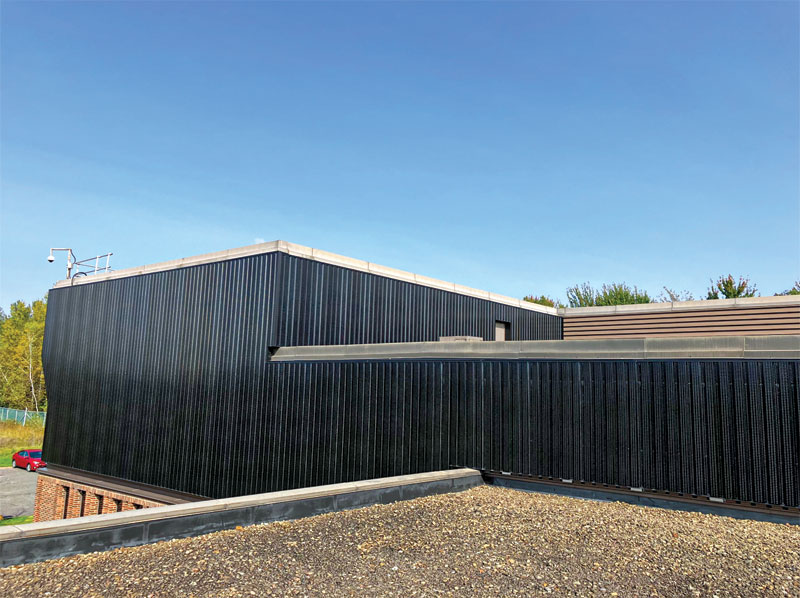 A transpired solar-air collector installed on top of a computer science building.