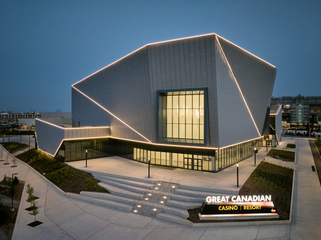 Great Canadian Casino Resort at dusk, featuring a dramatic metal facade with angular lines and LED accent lighting.