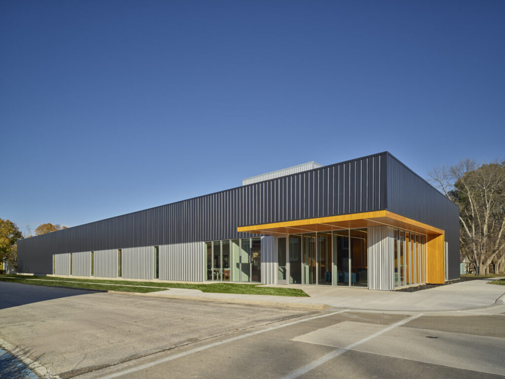 Sleek building exterior with black ribbed metal panels