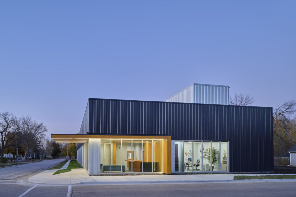 Sleek building exterior with black ribbed metal panels