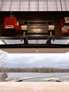 Interior view of open door. Schweiss Doors logo visible on liftstrap system.