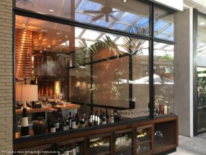 Interior view of steel windows with reflection on pane.