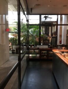 Interior view of restaurant with steel winodws.