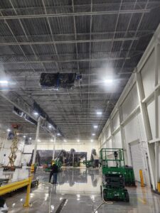 Tall industrial ceiling is featured in this image.