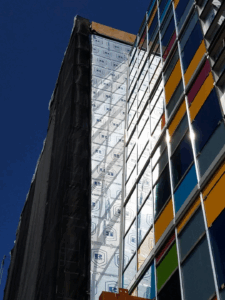 Side angle of building exterior featuring polyiso. Various colors appear on building segments offering an eclectic and bright aesthetic.
