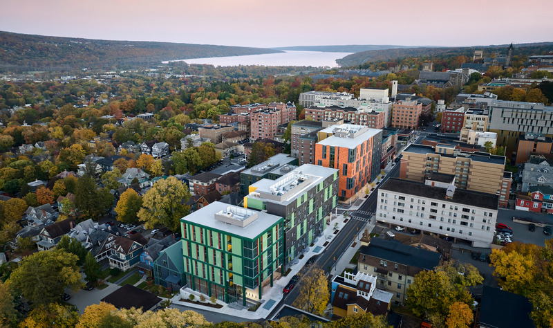 Overhead view of Catherine's Commons, a large complex with pastel green and orange exterior panels.