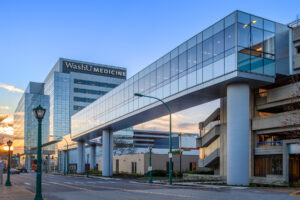 Exterior view of prominent bridge linking research building.