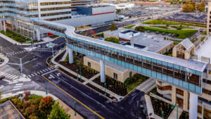 Overhead view of s-shaped research building and garage bridge.