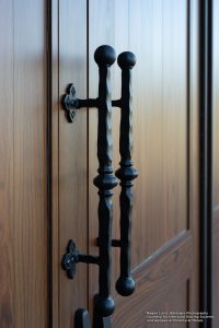 Close up image of door and door handles.