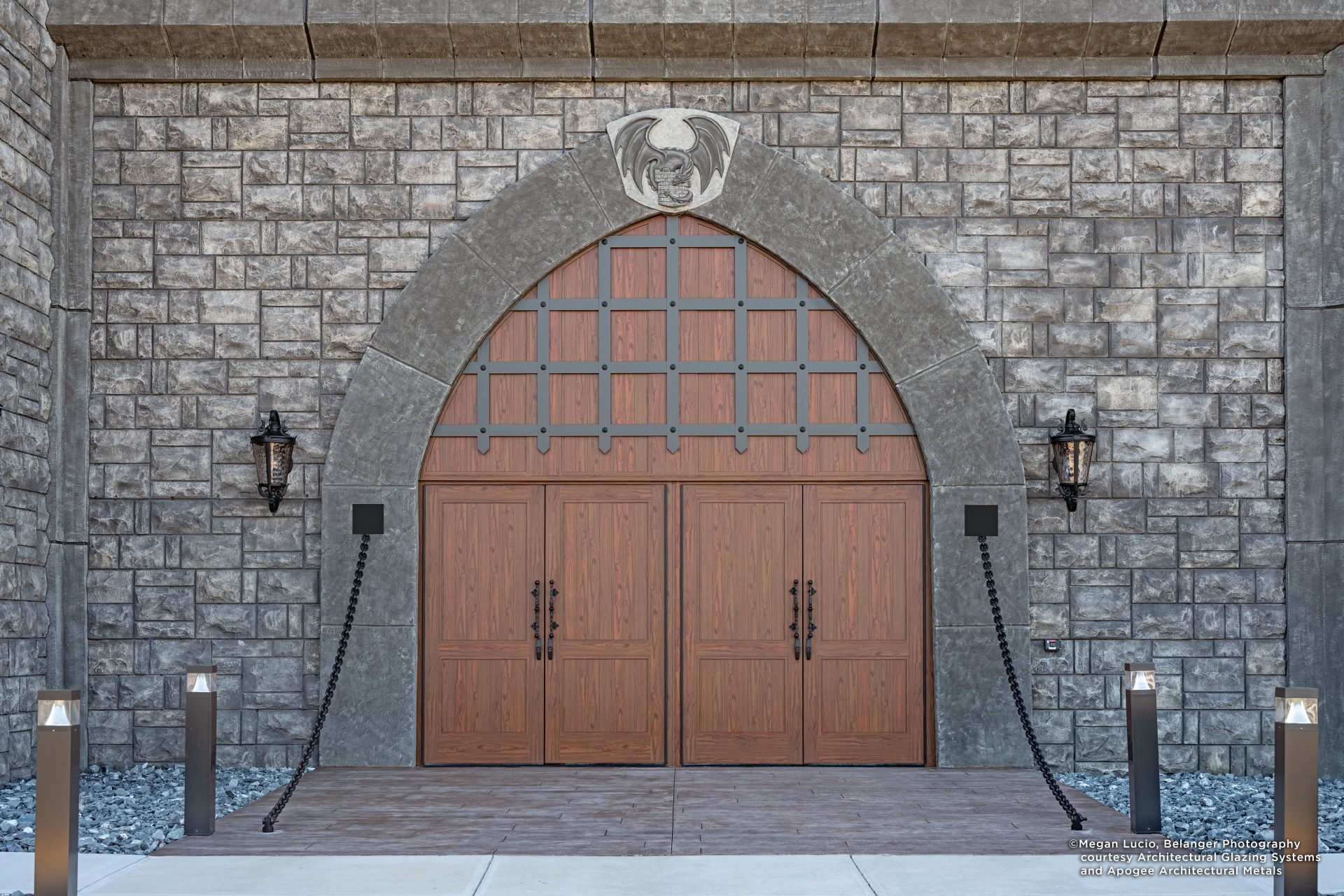 Image displaying how a metal entrance evokes medieval wonder with a dark wooden appearance.