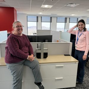Two women in an office setting.