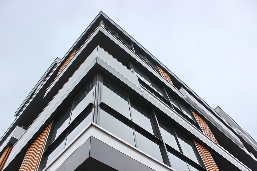 A residential building photographed from below.