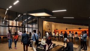 A warm-colored bar setting populated with people.