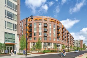 Curved MCM-coated facade of building photographed during the day.