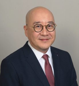 Headshot of man in suit