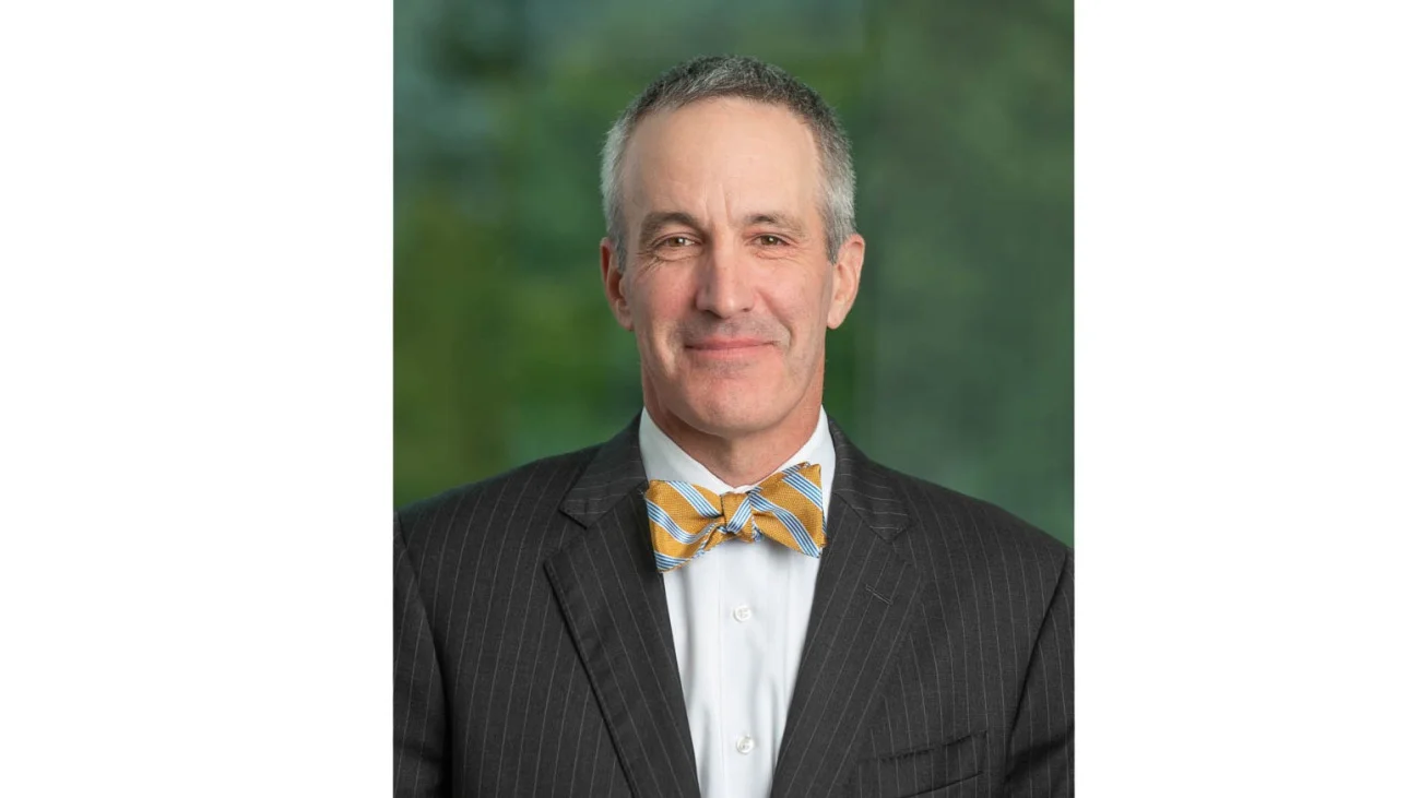 Headshot of man in suit and bowtie
