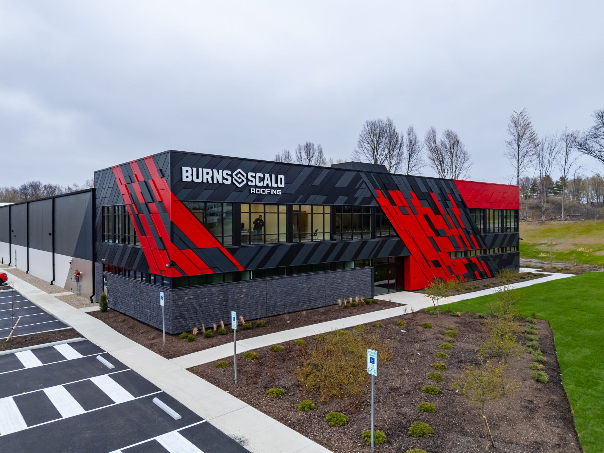 Metal facade with black and red coloring.