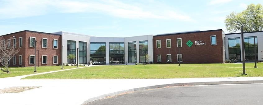 Two-story structure with metal paneling.