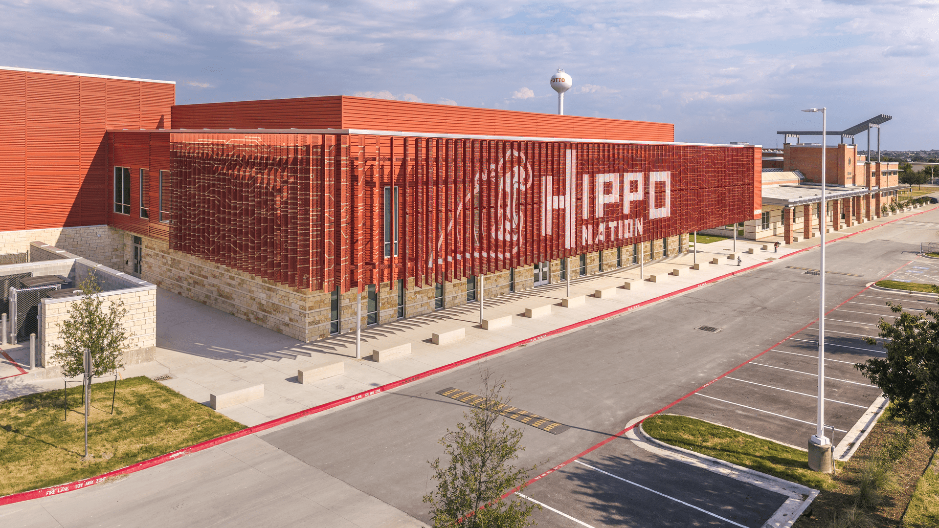 Modern education facility with orange metal fins.