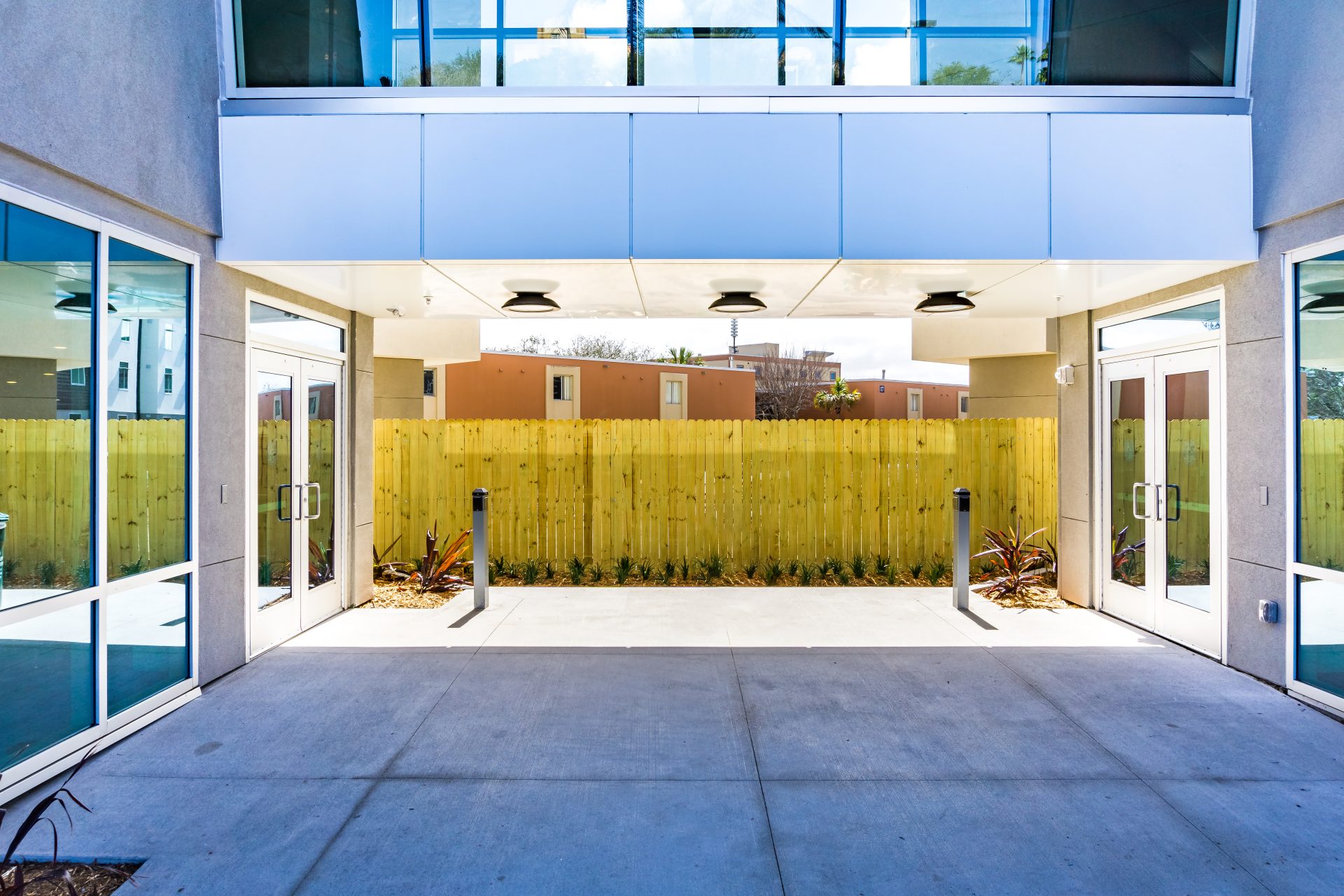 Aluminum doors on a building with pedestrian bridge