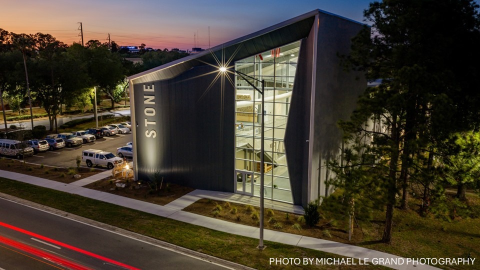 Nightime shot of angular metal building