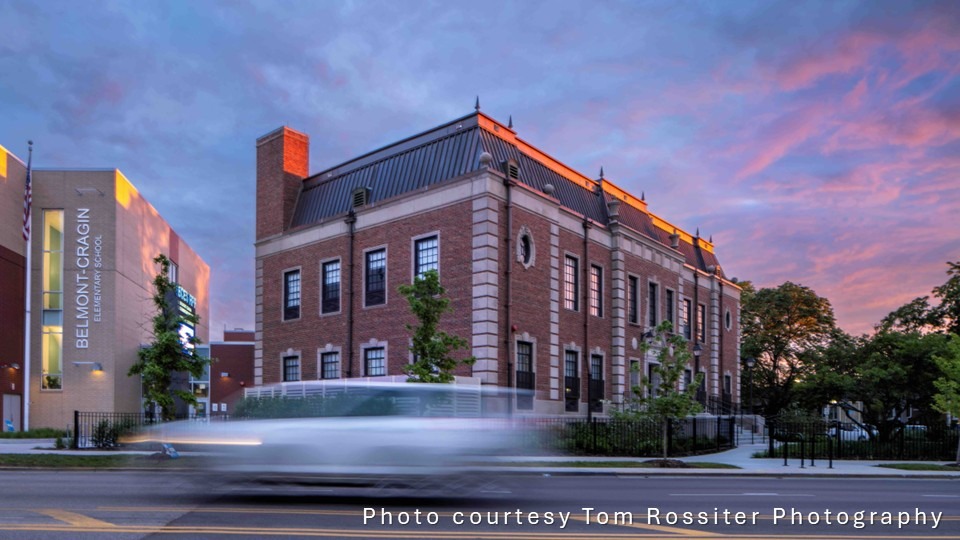 Historic building with copper roof photographed at night